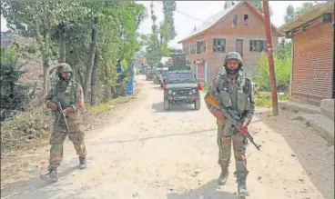  ?? WASEEM ANDRABI/HT ?? Army soldiers during a cordonands­earch operation at village Below, 35km south of Srinagar, in Pulwama on Monday.