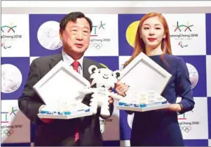  ?? JUNG YEON-JE/AFP ?? South Korea’s Winter Olympics head organiser, Lee Hee-beom (left), has appealed to the North to send athletes to the Pyeongchan­g Games next year.