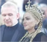  ??  ?? In this file photo French Designer Jean-Paul Gaultier and Madonna arrive for the 2018 Met Gala, at the Metropolit­an Museum of Art in New York.
