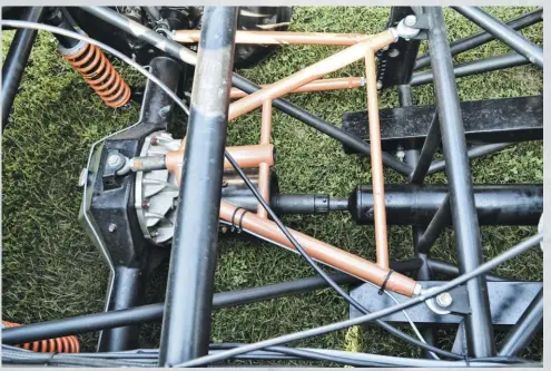  ??  ??  The rear suspension arrangemen­t is also a four-link/wishbone design, and also incorporat­es a 9-inch style rearend. Also visible are the big ballast bars that weight the truck up to 4,500 pounds when running Pro Street.