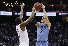  ?? JOHN MINCHILLO – THE ASSOCIATED PRESS ?? Villanova’s Collin Gillespie, right, shoots against Seton Hall’s Quincy McKnight during a Wildcats victory over the Pirates last week. Gillespie is ready for his first Big East tournament as team leader.