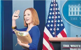  ?? DREW ANGERER GETTY IMAGES ?? White House Press Secretary Jen Psaki waves goodbye after her final daily press briefing on May 13. Her approach, and Joe Biden’s, are reminiscen­t of “The West Wing,” writes Edward Keenan, while the Republican­s have a very different TV model.