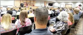  ?? TIMES photograph by Annette Beard ?? There were many more chairs available at first court held in the new court room at Pea Ridge City Hall last week. In the previous City Hall, there was room for 60 chairs and people usually stood outside waiting their turn for court. The new room had...