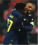  ??  ?? Bukayo Saka celebrates his goal with Alexandre Lacazette