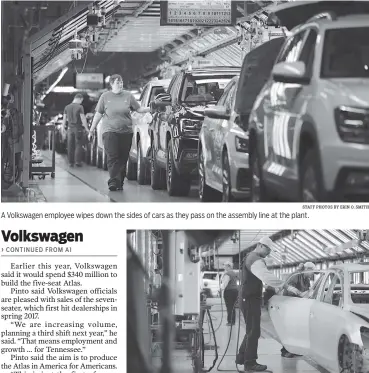  ?? STAFF PHOTOS BY ERIN O. SMITH ?? A Volkswagen employee wipes down the sides of cars as they pass on the assembly line at the plant. Volkswagen employees work in the “body in white” area, where an automobile’s body components are joined together, at the Chattanoog­a Volkswagen Assembly Plant last August.