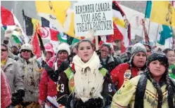  ??  ?? Far left: First Nations youth take part in an Idle No More march in Ottawa in 2013.