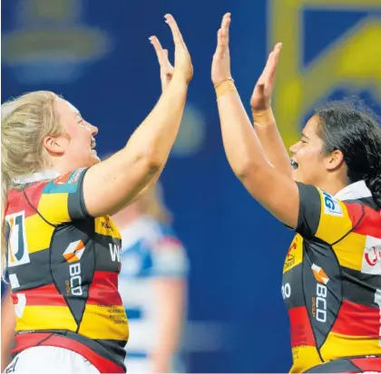  ?? Photo / Getty Images ?? Waikato’s Ashlee Gaby-Sutherland (left) and teammate, Kihikihi’s Merania Paraone, celebrate during the round six Farah Palmer Cup match against Auckland.