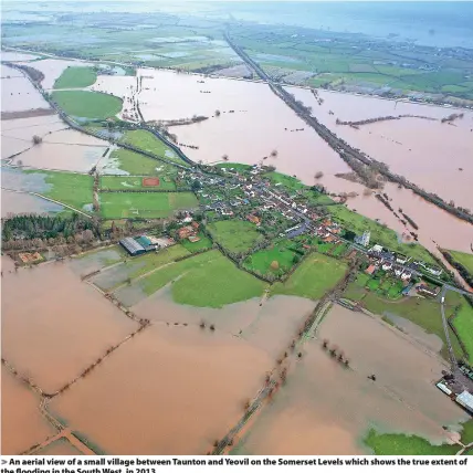  ?? ?? An aerial view of a small village between Taunton and Yeovil on the Somerset Levels which shows the true extent of the flooding in the South West, in 2013