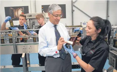  ??  ?? Chief executive Ivan Menezes during his tour of Diageo’s Leven packaging plant.