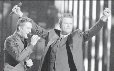  ?? Max Faulkner ?? LUKE BRYAN, left, and Blake Shelton co-hosted the Academy of Country Music Awards show Sunday night.