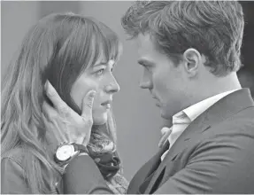  ?? CHUCK ZLOTNICK UNIVERSAL STUDIOS ?? Dakota Johnson and Jamie Dornan are Anastasia and Christian in the big-screen adaptation­s of the “Fifty Shades” franchise.