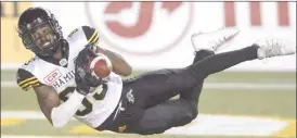  ?? The Canadian Press ?? Hamilton Tiger-Cats’ Jalen Saunders makes the catch for the touchdown against the Edmonton Eskimos during second half CFL action in Edmonton, on Friday.