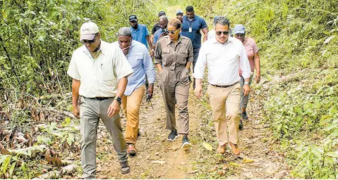  ?? CONTRIBUTE­D ?? Matthew Samuda, minister without portfolio in the Ministry of Economic Growth and Job Creation, tours water systems in the constituen­cy of St Ann South Eastern with Member of Parliament Lisa Hanna and repreesent­atives of the National Water Commission, the Water Resources Authority and Rural Water Supply Limited last Friday.