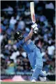  ?? | EPA ?? VIRAT Kohli of India smashes the ball to the boundary during a match at the T20 World Cup.