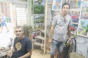  ?? PHOTO: TNS ?? Cashing in on tourism . . . Cuban artists Mario Echevarria (left) and Nelson Labrada.