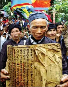  ?? PHOTOS PROVIDED TO CHINA DAILY ?? From left: The written language of the Sui ethnic group, Shuishu; Only Shuishu masters can read and decode old scripts copied by hand from generation to generation.