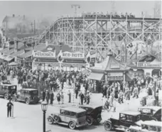  ?? TORONTO STAR ARCHIVES ?? South of the King, Queen and Roncesvall­es intersecti­on, Sunnyside Amusement Park was a favourite that featured daredevils, performing animals and rides like the Flyer roller coaster, shown here circa 1920.