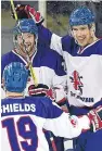  ??  ?? Matthew Myers, right, celebrates one of his goals against Japan.