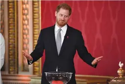  ?? REUTERS ?? BRITAIN’S Prince Harry attends at the draw for the Rugby League World Cup, where children from a local school will play rugby league in the Buckingham Palace gardens, in London, Britain, Jan. 16.