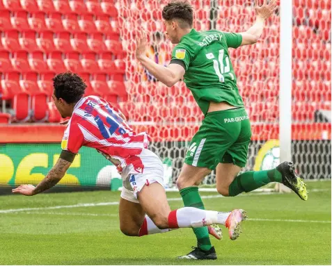  ?? Pics: Steve Bould & Getty ?? BIG CALL: Christian Norton is sent tumbling by Preston’s Jordan Storey, but no penalty was awarded.