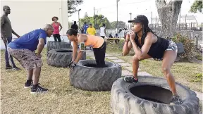  ??  ?? Intense sledgehamm­er and tyre training.