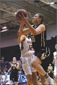  ?? Photo courtesy of Jeff Montgomery ?? Harding forward Caroline Hogue heads for the basket in the first half of Wednesday’s game against Ashland (Ohio). The Lady Bisons’ loss ended their 17-game winning streak as well as their season.