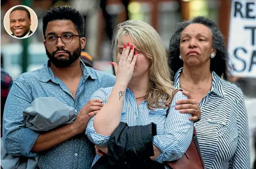  ?? AP ?? People gather during a Mothers Against Police Brutality candleligh­t vigil for Botham Jean, inset, at the Jack Evans Police Headquarte­rs in Dallas. Authoritie­s are seeking a manslaught­er warrant for the Dallas police officer who shot and killed Jean.