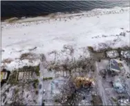  ?? DAVID GOLDMAN — THE ASSOCIATED PRESS ?? Damaged homes are seen along the water’s edge in the aftermath of hurricane Michael in Mexico Beach, Fla., Friday, Oct. 12, 2018.