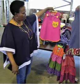  ??  ?? Sikhona Managing Director Khosi Jayiya saw a gap in the market and decided to manufactur­e ethnic clothes for children.