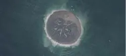  ?? CNES/DISTRIBUTI­ON ASTRIUM SERVICES/AFP/GETTY IMAGES ?? This small island of mud and rock appeared in the Arabian Sea after a strong earthquake hit Pakistan.