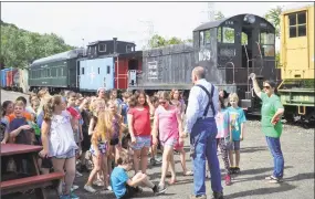  ?? RMNE / Contribute­d photo ?? Fourth-grade students and teachers from Thomaston Center School visit at the Thomaston Train Station, where they were welcomed by Railroad Museum of New England president, Steve Casey near the end of the school year.