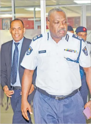  ?? Picture: ELIKI NUKUTABU ?? Acting Police Commission­er Rusiate Tudravu is followed by Unit Trust of Fiji’s Sakiusa Bolaira during their signing at the Police HQ at Laucala Beach Estate in Nasinu yesterday.