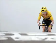  ?? Picture: REUTERS ?? HEAD DOWN: Team Sky rider Geraint Thomas works hard during stage 17 yesterday.