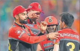  ?? PTI ?? RCB bowler Y Chahal with teammates celebrates the dismissal of KKR batsman Y Pathan during an IPL match in Kolkata on Sunday.