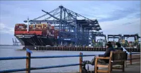  ?? Ben Styansall/AFP via Getty Images ?? Stacks of containers line the deck of the MSC Allegra, docked beside cranes at the United Kingdom’s largest freight port, on Saturday in Felixstowe on the East coast of England. Hundreds of cargo ships and tankers are being rerouted around the southern tip of Africa to avoid Houthi attacks in the Red Sea.