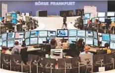  ?? Rex Features ?? Traders at the Frankfurt Stock Exchange. Stock markets in Europe rose 0.25 per cent, supported by positive results.