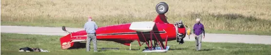  ?? LYLE ASPINALL ?? A 1930 Fleet Model 2 biplane sits on its roof next to a runway at the Springbank Airport west of Calgary on Tuesday. The pilot walked away without injuries.