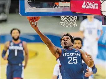  ?? JOHN PETERSON/AP PHOTO ?? UConn needs better production from all of its seniors, including Josh Carlton (25), when the Huskies host Butler on tonight in a Big East game at Gampel Pavilion.