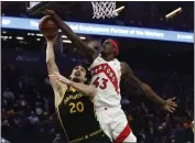  ?? NHAT V. MEYER — BAY AREA NEWS GROUP ?? The Toronto Raptors' Pascal Siakam (43) blocks a shot against the Golden State Warriors' Dario Šarić (20) in the third quarter in San Francisco on Sunday.