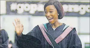  ?? MITCH MACDONALD/THE GUARDIAN ?? Valedictor­ian Oluwafoyin­sayemi Ifemide “Foyin” Senbanjo waves to a faculty member after receiving her bachelor of business administra­tion co-operative education degree during Saturday’s morning convocatio­n. Senbanjo, of Lagos, Nigeria, came to UPEI...