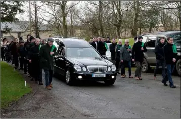  ??  ?? Members of St Fintan’s GAA Club provide a guard of honour at the funeral of William Codd in Mayglass on Saturday.