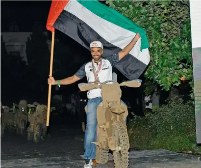  ?? Supplied photo ?? A proud moment for Mohammed Al Balooshi after he became the first UAE rider to win the Bajas World title. —