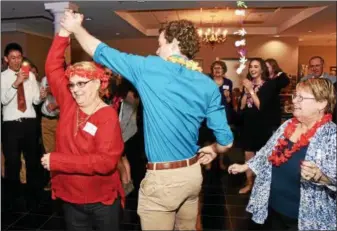  ?? JESI YOST — DIGITAL FIRST MEDIA ?? Boyertown Area High School senior David Helmer spins Helen Vanderslic­e on the dance floor during SeniorSeni­or Prom on March 9.