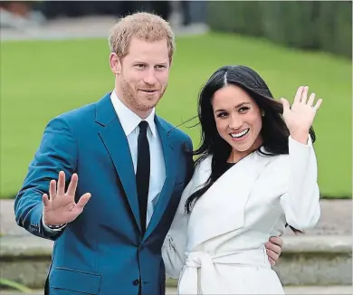  ?? EDDIE MULHOLLAND THE ASSOCIATED PRESS ?? Britain's Prince Harry, left, and Meghan
Markle will wed Saturday, May 19.