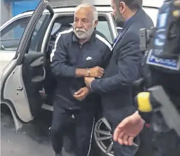  ?? PICTURE: WEST YORKSHIRE POLICE/PA ?? Piran Ditta Khan being taken into custody in Leeds after his extraditio­n from Pakistan last year