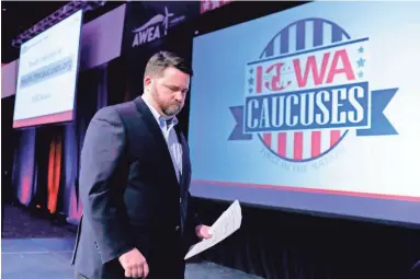  ?? AFP VIA GETTY IMAGES ?? Troy Price, chairman of the Iowa Democratic Party, exits the stage Tuesday after speaking about the technical issues that delayed the results of Monday night’s Iowa Democratic presidenti­al caucuses.