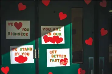  ?? AP PHOTO/JOHN C. CLARK ?? Messages of support for teacher Abby Zwerner, who was shot by a 6 year old student, adorn the front door of Richneck Elementary School Newport News, Va. on Jan. 9.