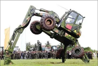  ?? HENG CHIVOAN ?? A new military vehicle is taken through its paces during the first Chinese-Cambodian Golden Dragon military exercises in 2016. The Ministry of Defence unveiled details for this month’s iteration yesterday.