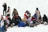  ?? ?? People smoke water pipes outside the Lebanese ski resort of Faraya, in Mount Lebanon north of Beirut, on February 23, 2024.