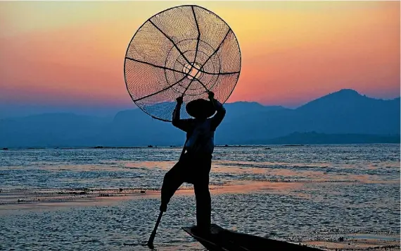  ?? PHOTOGRAPH­ER: KHRISTINE RAE ROMENA ?? ‘‘I went on a 10-day backpackin­g trip to Myanmar in February 2015. This was at Inle Lake. Fishermen navigate their boats by using their feet. This was one of the many fishermen we came across before heading back to town.’’